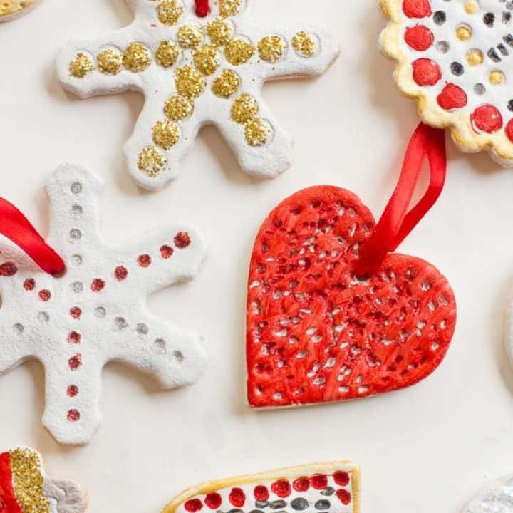 salt dough ornaments, one red heart, two snowflakes